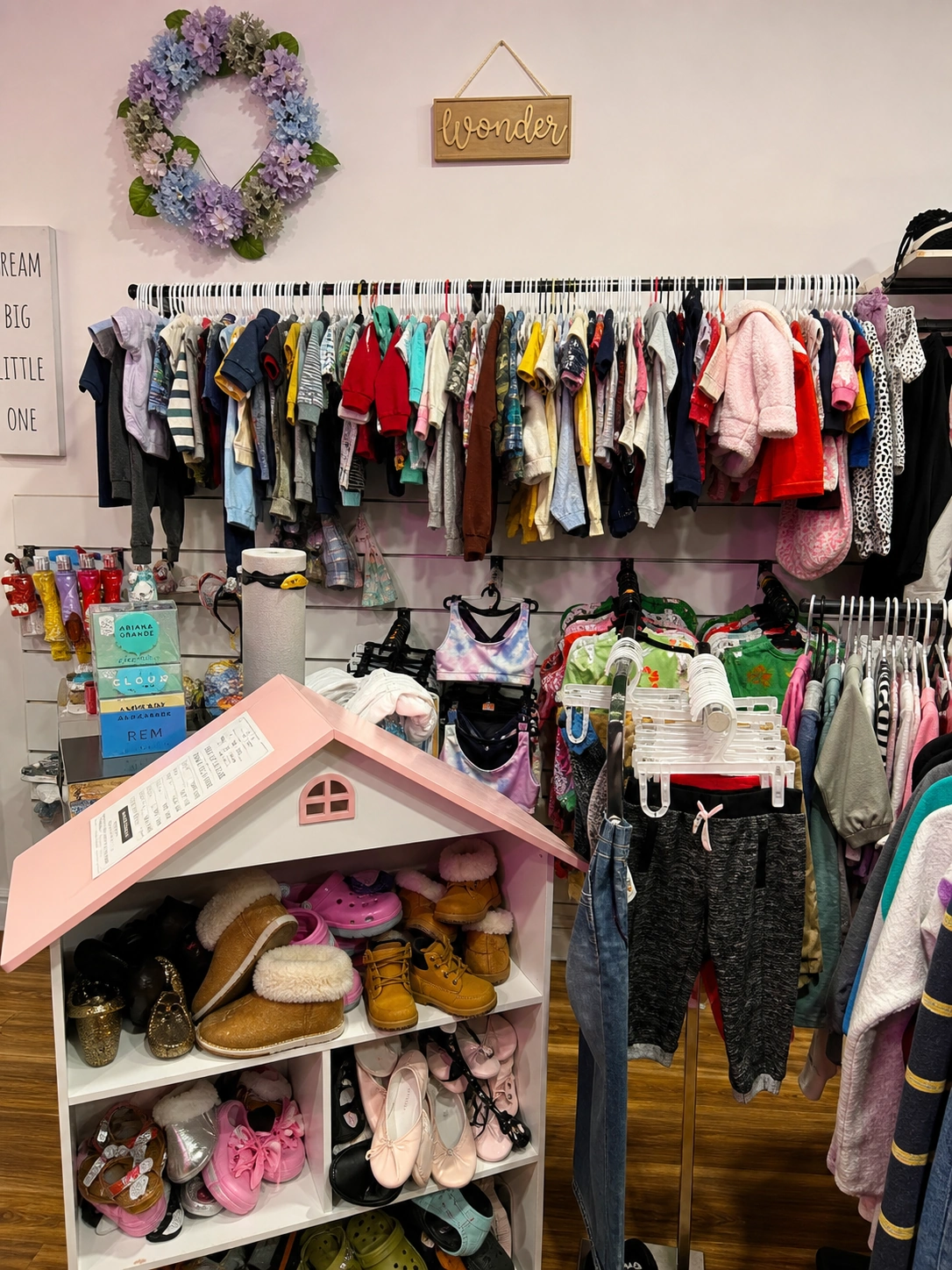 Colorful clothing racks and accessories inside The Style Exchange